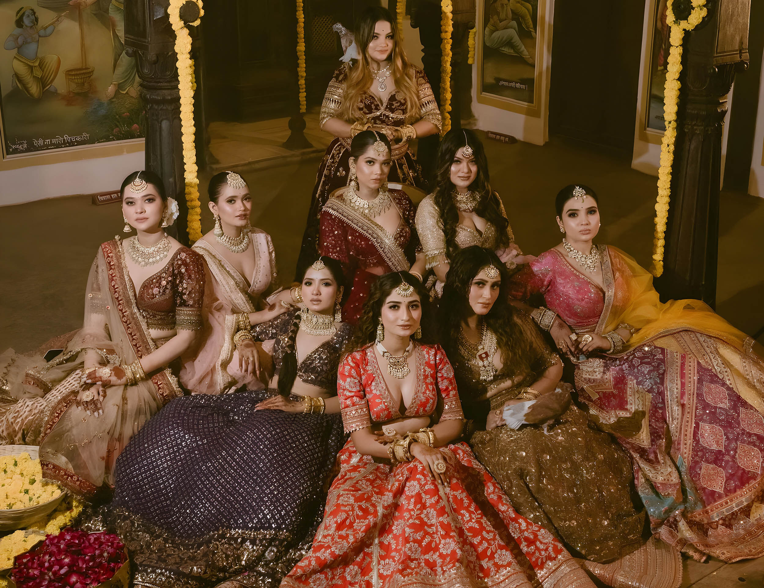 Bride and bridesmaid flaunting their lehengas and applyed kajal on eyes for wedding